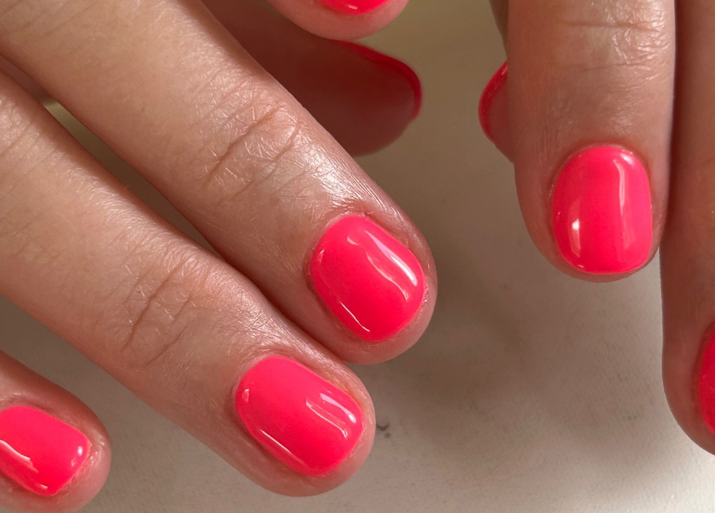 Bright pink manicure at Shefford Manicurist, Shefford, England, GB.