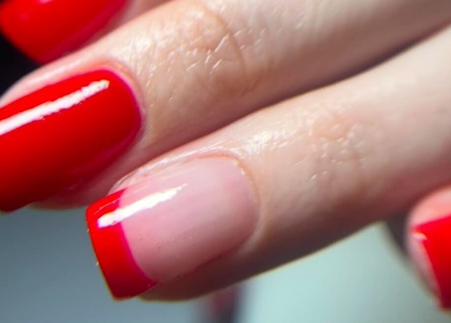 Bright red manicured nails at Shefford Manicurist, Shefford, England, GB showcasing expert nail artistry.