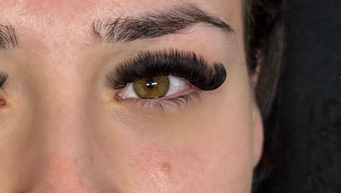 Close-up of elegant eyelash extensions by lashedbylgx in Great Notley, England, GB, showcasing intricate details.