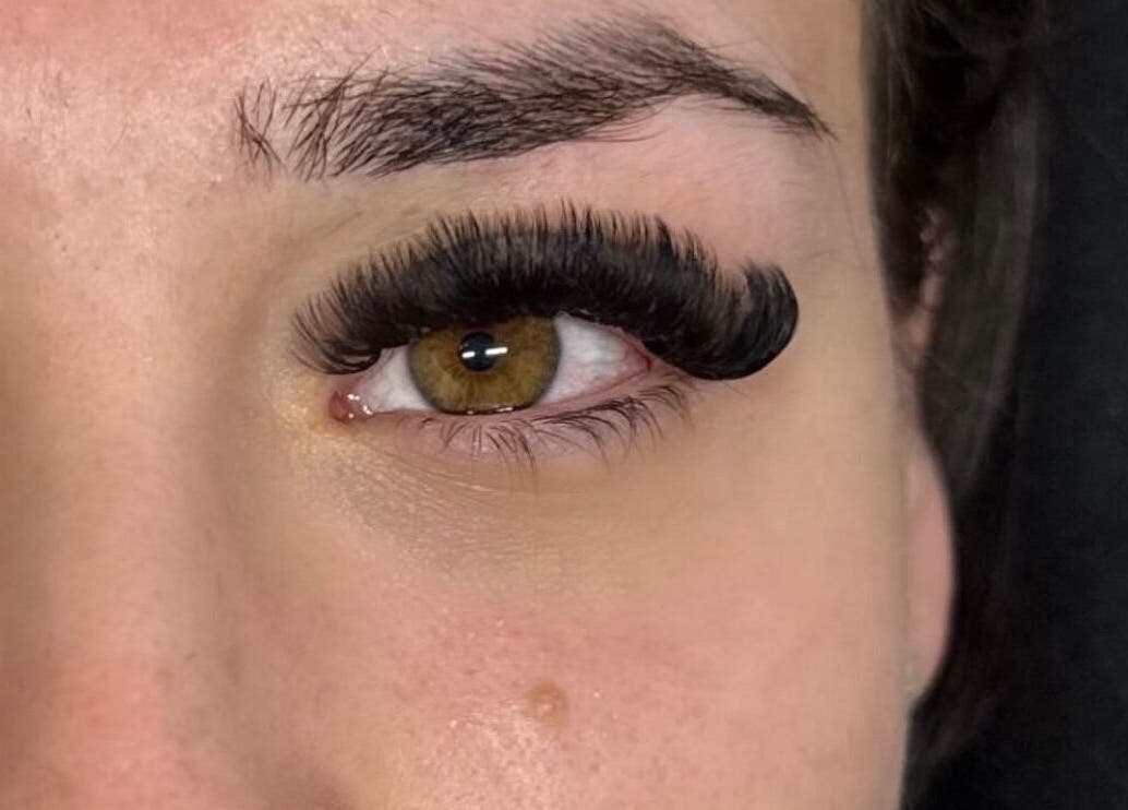 Close-up of elegant eyelash extensions by lashedbylgx in Great Notley, England, GB, showcasing intricate details.