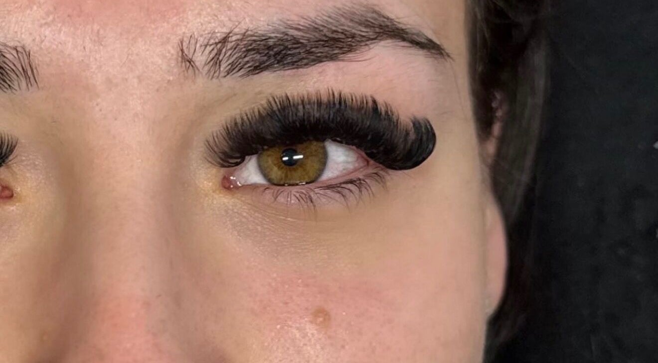 Close-up of elegant eyelash extensions by lashedbylgx in Great Notley, England, GB, showcasing intricate details.