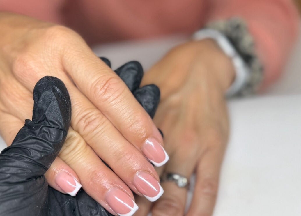 French manicure at lashedbylgx in Great Notley, England, GB showcasing delicate nail art.