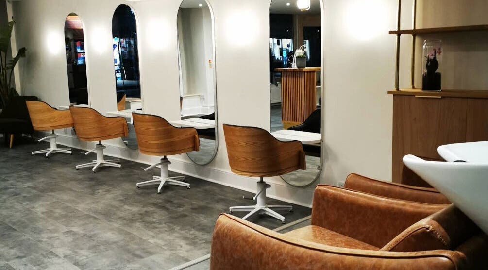 Modern salon chairs and mirrors at Thierry Lambert, Portsmouth, England, GB offering a chic aesthetic.