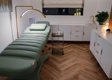 Luxurious spa room at Essential Beauty Essex - Rayleigh, Rayleigh, England, GB with a plush treatment bed.