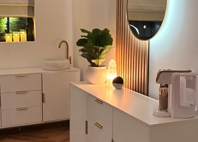 Elegant wellness room at Essential Beauty Essex - Rayleigh, featuring a warm, welcoming candlelit ambiance in Rayleigh, England, GB.
