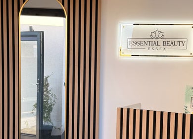 Essential Beauty Essex - Rayleigh reception area features modern decor and branding in Rayleigh, England, GB.