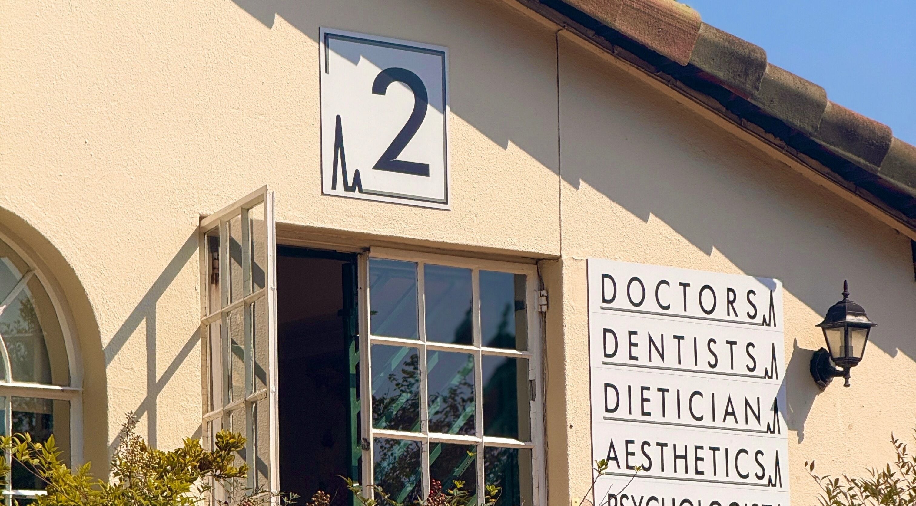 Mii Health venue facade in Johannesburg, Gauteng, ZA, featuring vibrant signage for various wellness services.