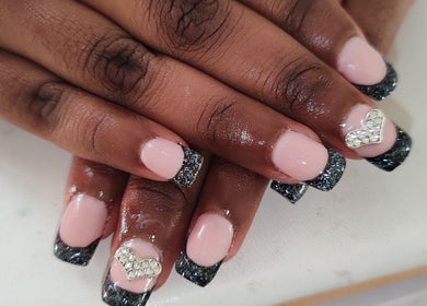 Stylish pink nails with glitter tips and rhinestone heart at Allure Beauty by Wianda, Gqeberha, Eastern Cape, ZA.
