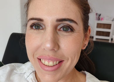 Woman with radiant smile at Allure Beauty by Wianda, Gqeberha, Eastern Cape, ZA showing natural makeup look.
