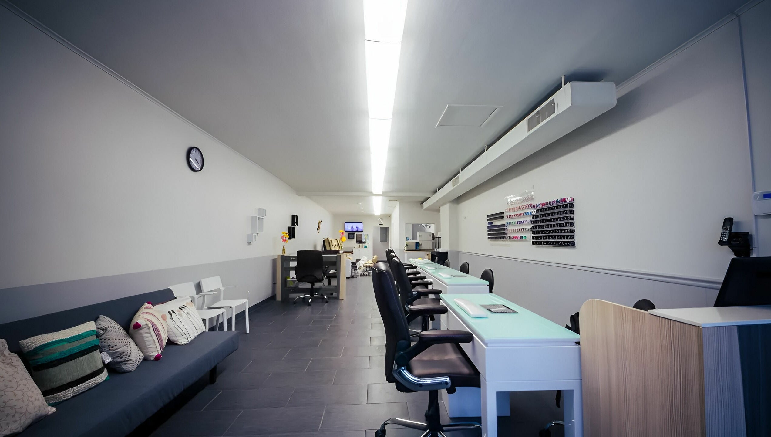Bright interior of Gentle Nails in St. Louis, Missouri, US showcasing modern nail stations and cozy seating.