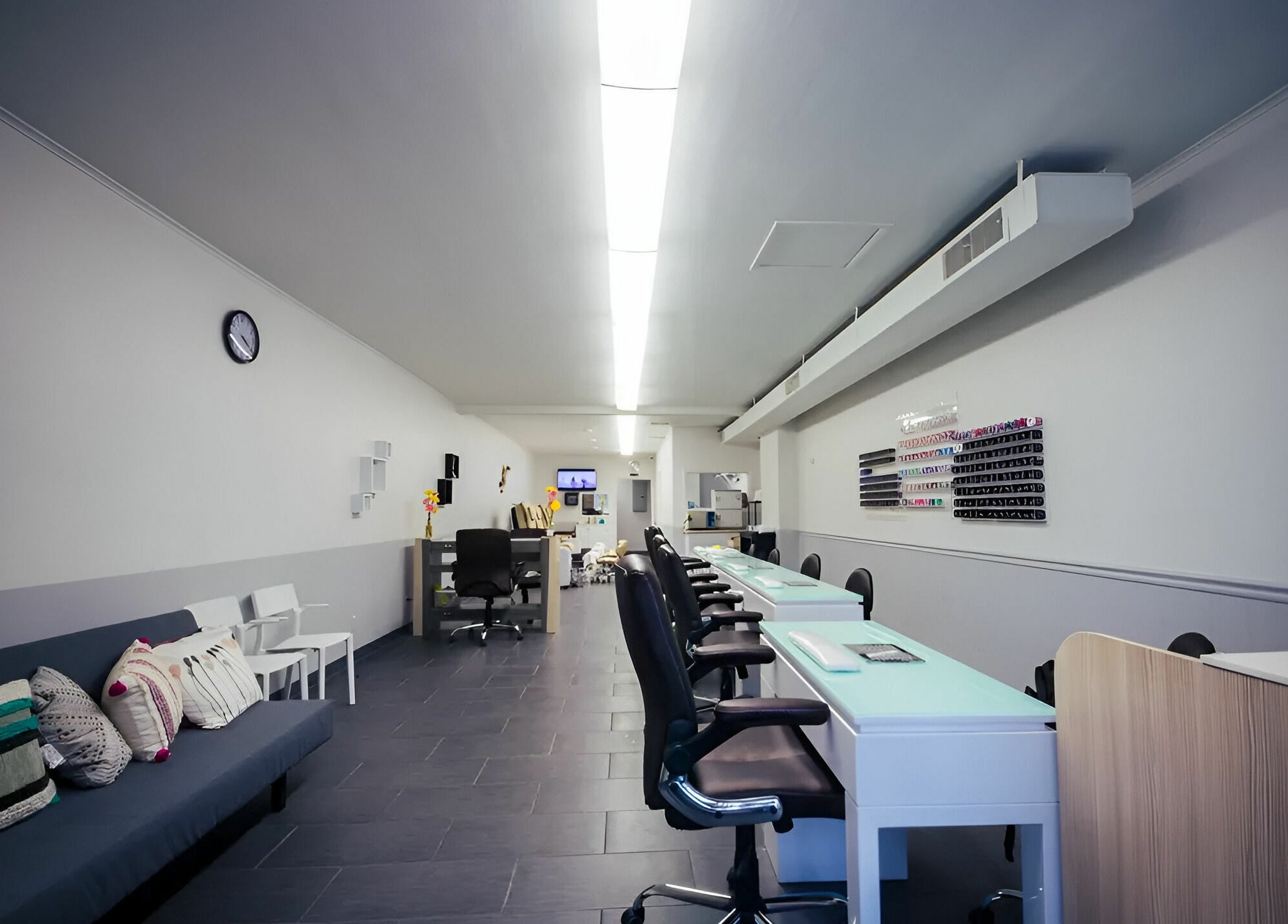 Bright interior of Gentle Nails in St. Louis, Missouri, US showcasing modern nail stations and cozy seating.