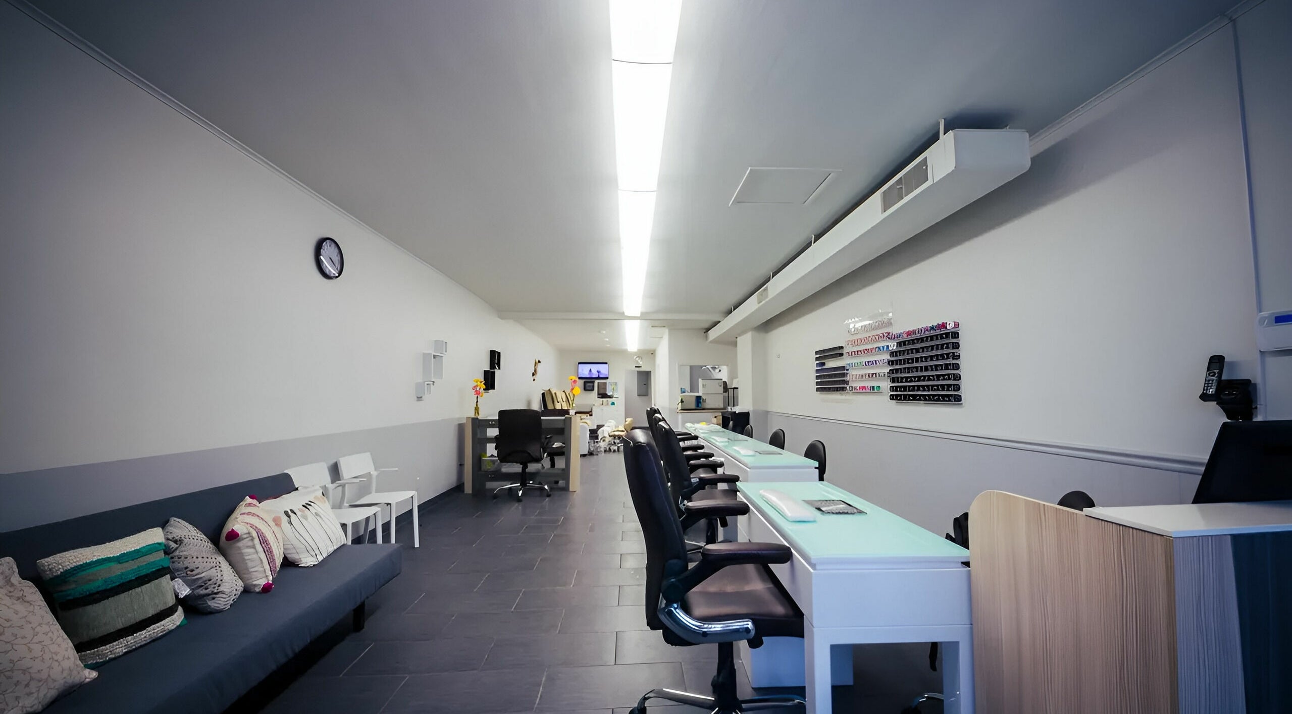 Bright interior of Gentle Nails in St. Louis, Missouri, US showcasing modern nail stations and cozy seating.