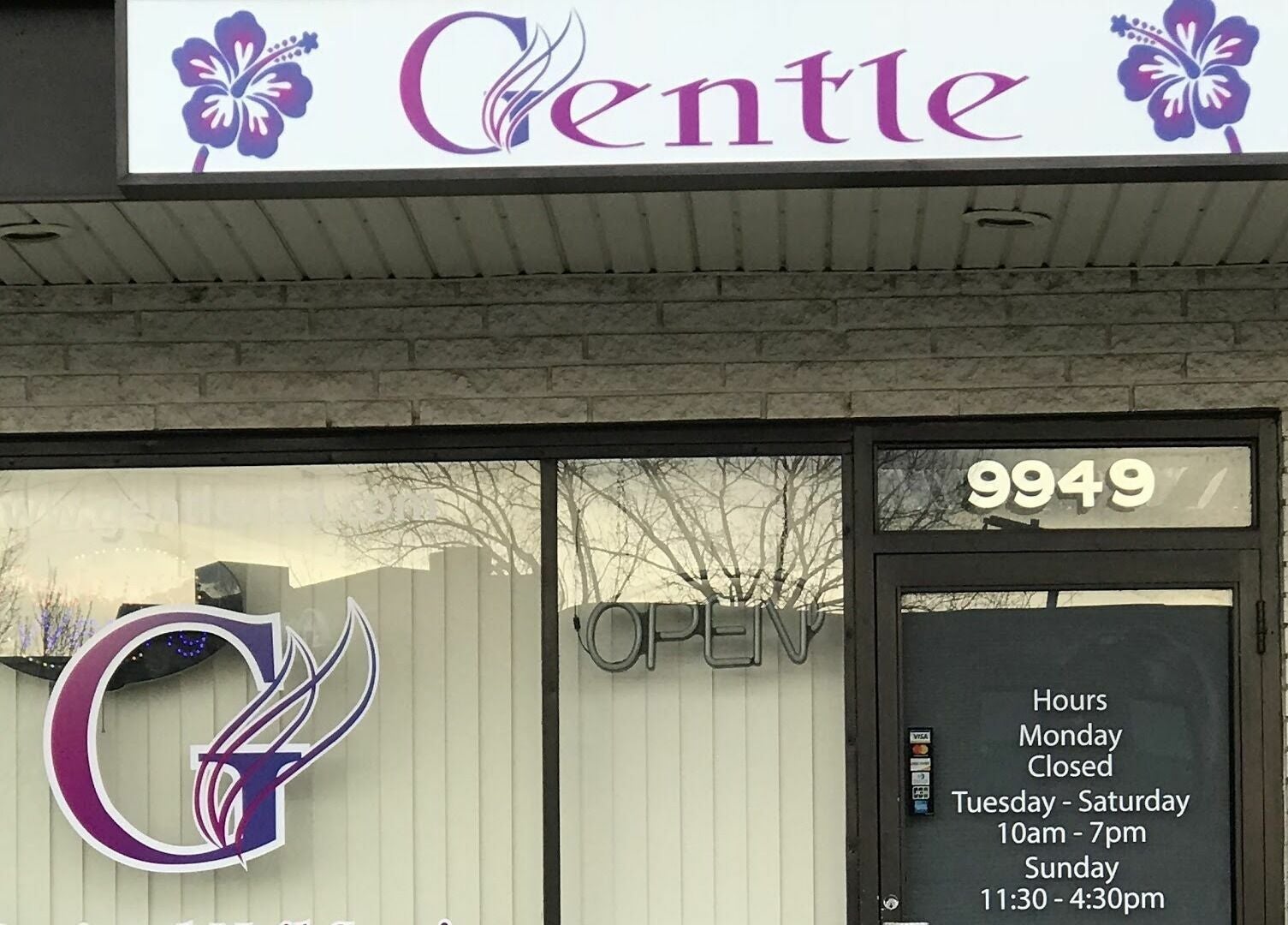 Front view of Gentle Nails in St. Louis, Missouri, US. Featuring vibrant signage and glass door entryway.