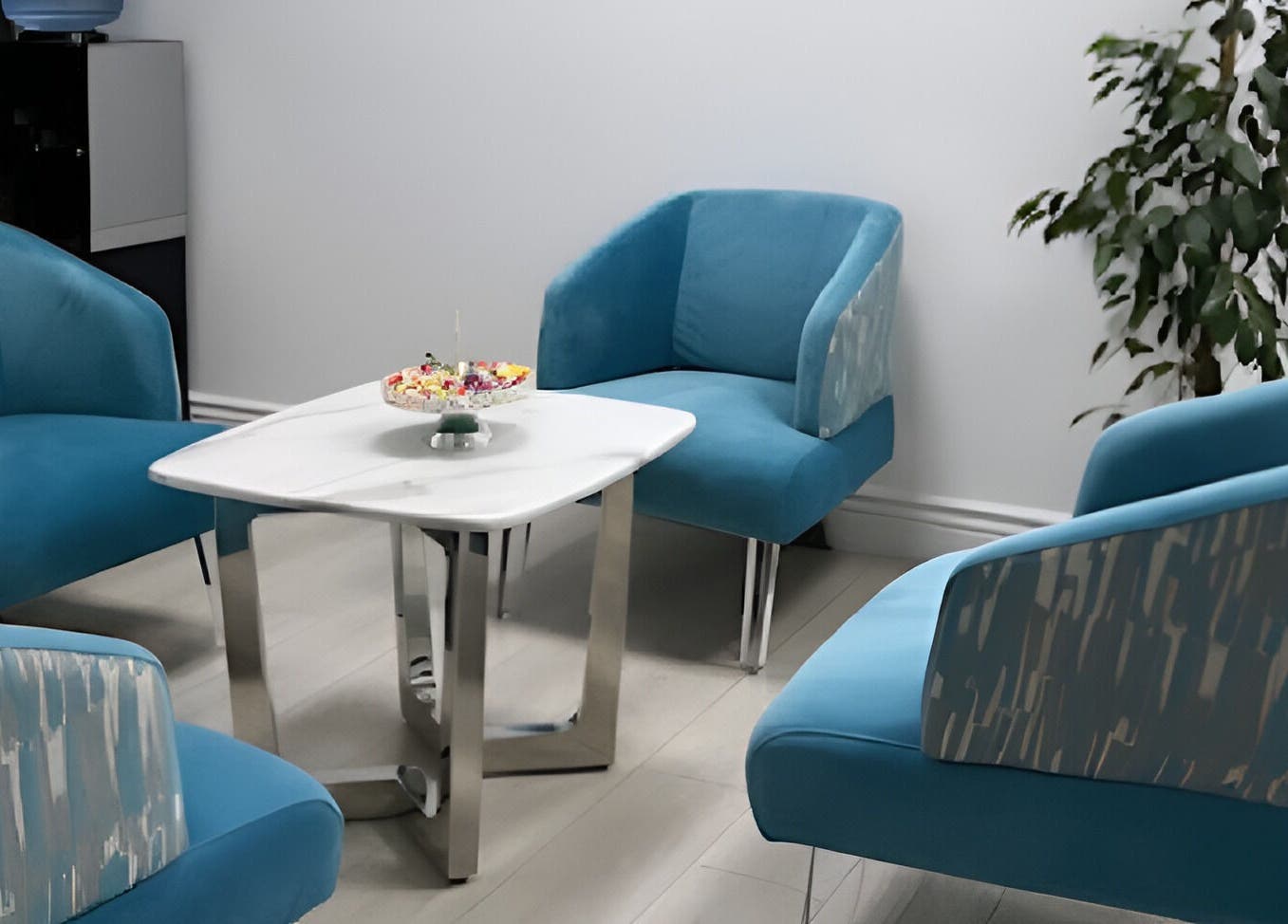 Relaxing seating area with blue chairs at Skin Masters Aesthetics Center, Lusail, Al Daayen Municipality, QA.