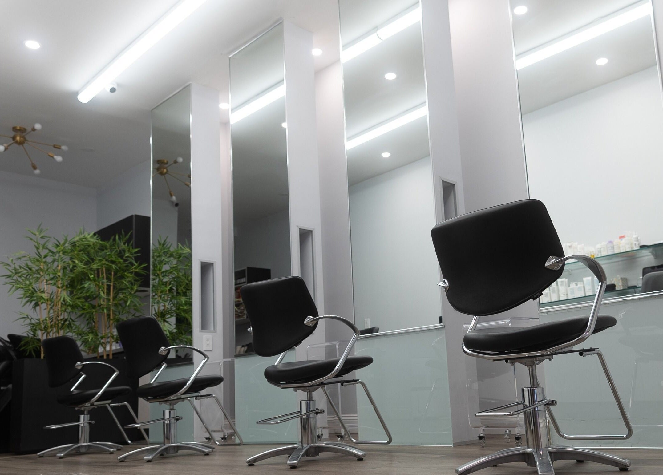 Modern salon chairs and mirrors at Assort New York, New York, New York, US.