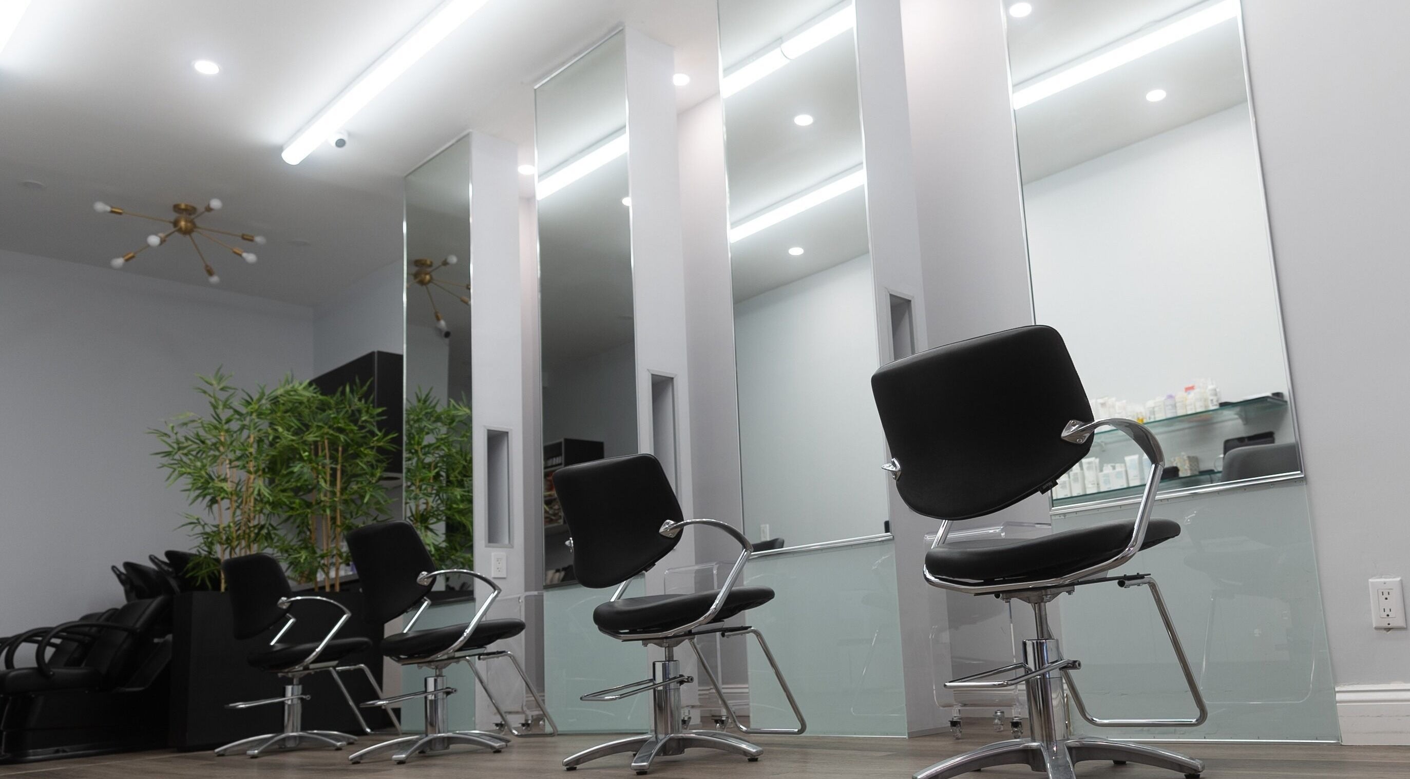 Modern salon chairs and mirrors at Assort New York, New York, New York, US.