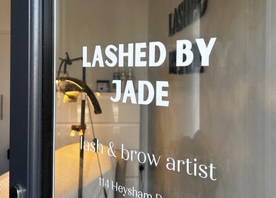 Lashed by Jade entry sign on glass door, Heysham, England, GB.
