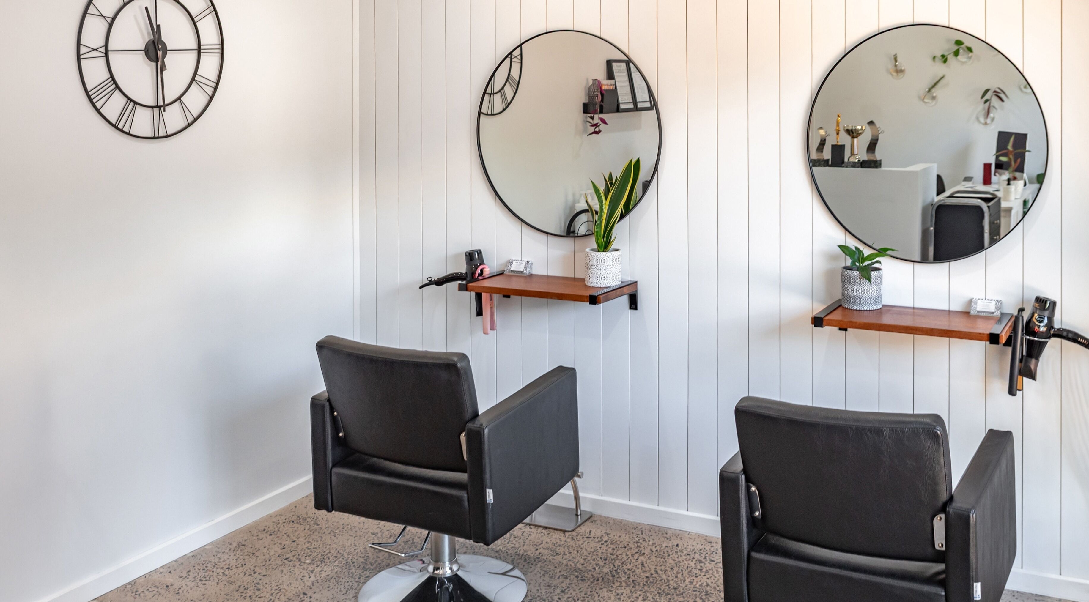 Stylish salon chairs and mirrors at Petite Boutique Hair Studio, Pasadena, South Australia, AU.