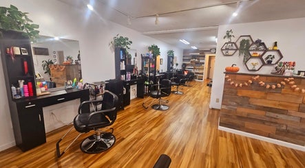 Interior of Rose Room Salon in Oxford, Ohio, US featuring sleek chairs and styling stations.