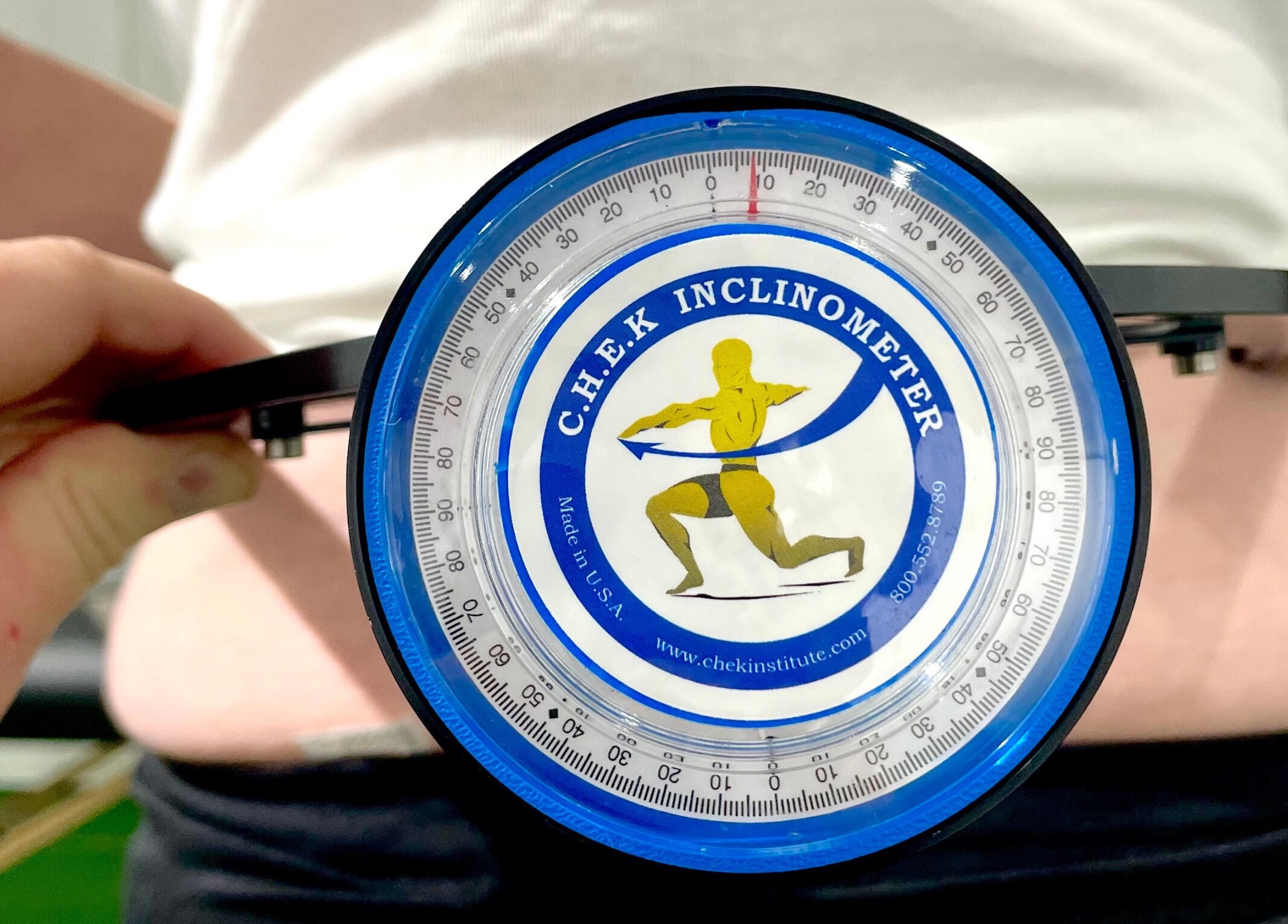 Close-up of inclinometer used for spinal assessment at Core 3 Wellness, Lostock Hall, England, GB.