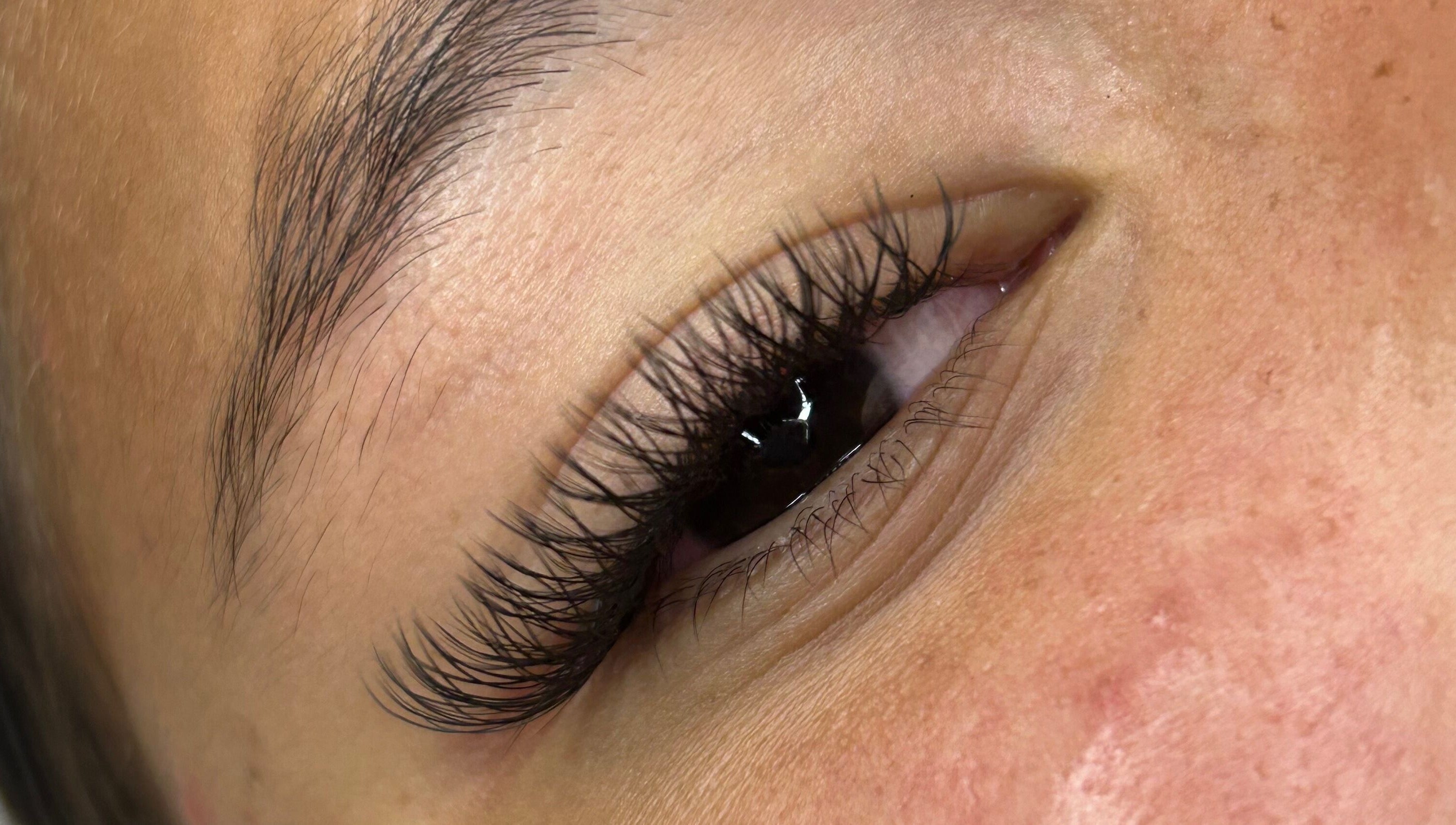Close-up of perfectly applied eyelash extensions at S Lashbar, Cape Town, Western Cape, ZA.