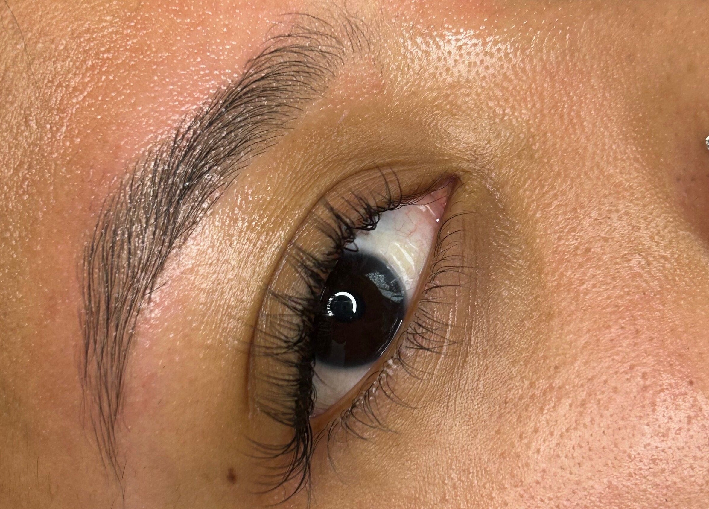 Close-up of perfectly groomed eyebrow and eye at S Lashbar, Cape Town, Western Cape, ZA.