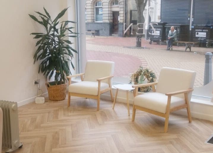 Inviting lounge area at Hippi Lash + Beauty, Sutton-in-ashfield, England, GB, with chairs and plants.