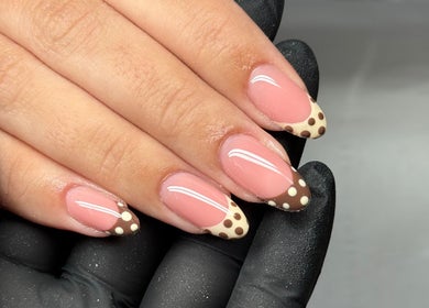 Elegant nail art with brown polka dots at Sculpt Beauty Lounge, Ewloe Green, Ewloe, Wales, GB.