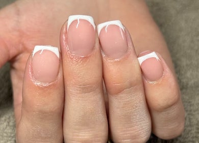 Stylish French manicure nails at Sculpt Beauty Lounge, Ewloe Green, Ewloe, Wales, GB. Perfectly polished elegance.