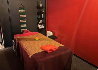 Relaxing massage room at OrientalBay Amarin Thai Massage & Spa, Wellington, Wellington, NZ with warm decor.