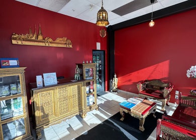 Elegant interior of OrientalBay Amarin Thai Massage & Spa, Wellington, featuring gold accents and Thai decor.