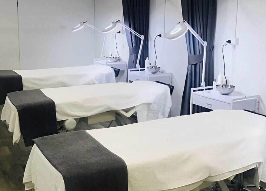 Spa treatment room with massage tables at Ccbt Student Salon, Melbourne, Victoria, AU, designed for relaxation.