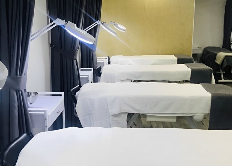 Modern treatment beds at Ccbt Student Salon in Melbourne, Victoria, AU offer a tranquil wellness experience.