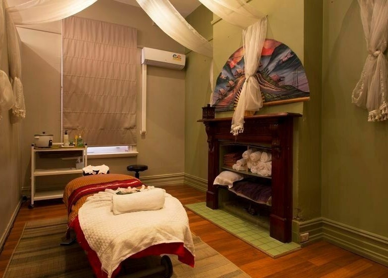Relaxing massage room at Silk Day Spa Camberwell, Melbourne, Victoria, AU with soothing decor and ambient lighting.
