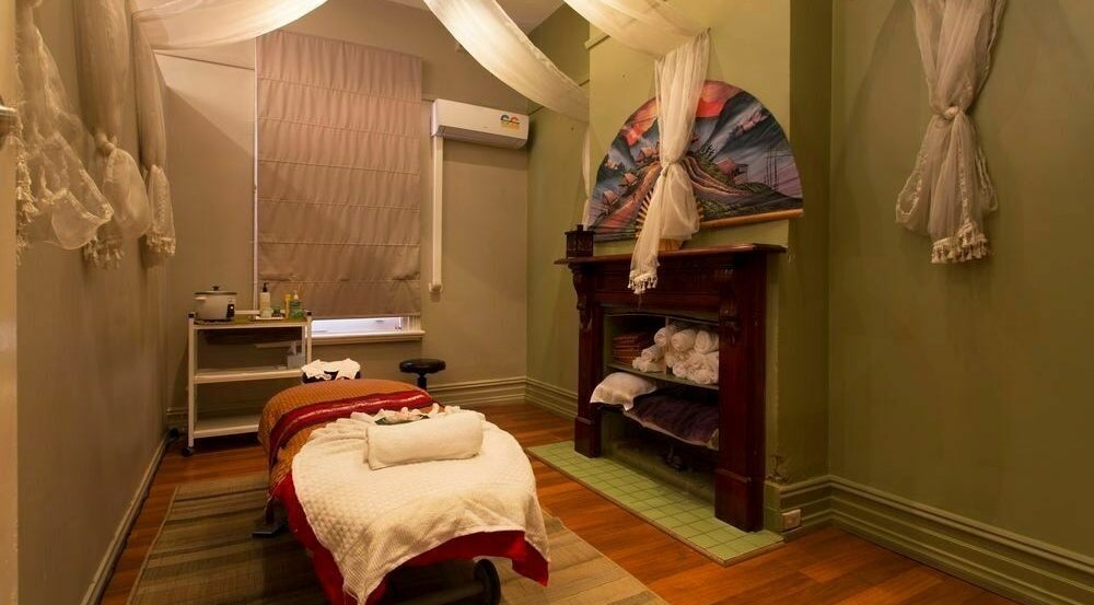 Relaxing massage room at Silk Day Spa Camberwell, Melbourne, Victoria, AU with soothing decor and ambient lighting.