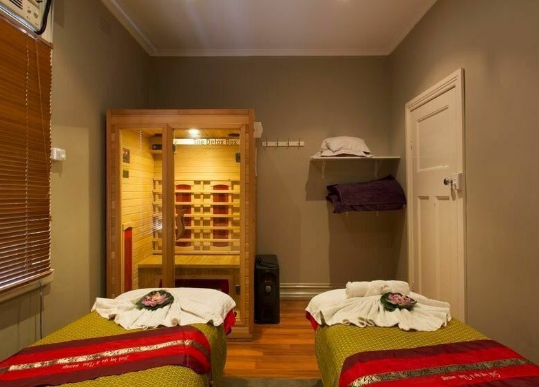 Relaxing massage room at Silk Day Spa Camberwell, Melbourne, Victoria, AU with cozy decor and warm lighting.