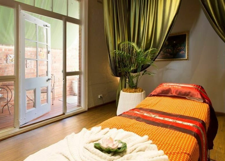 Relaxing massage room at Silk Day Spa Camberwell, Melbourne, Victoria, AU with cozy decor and serene ambience.
