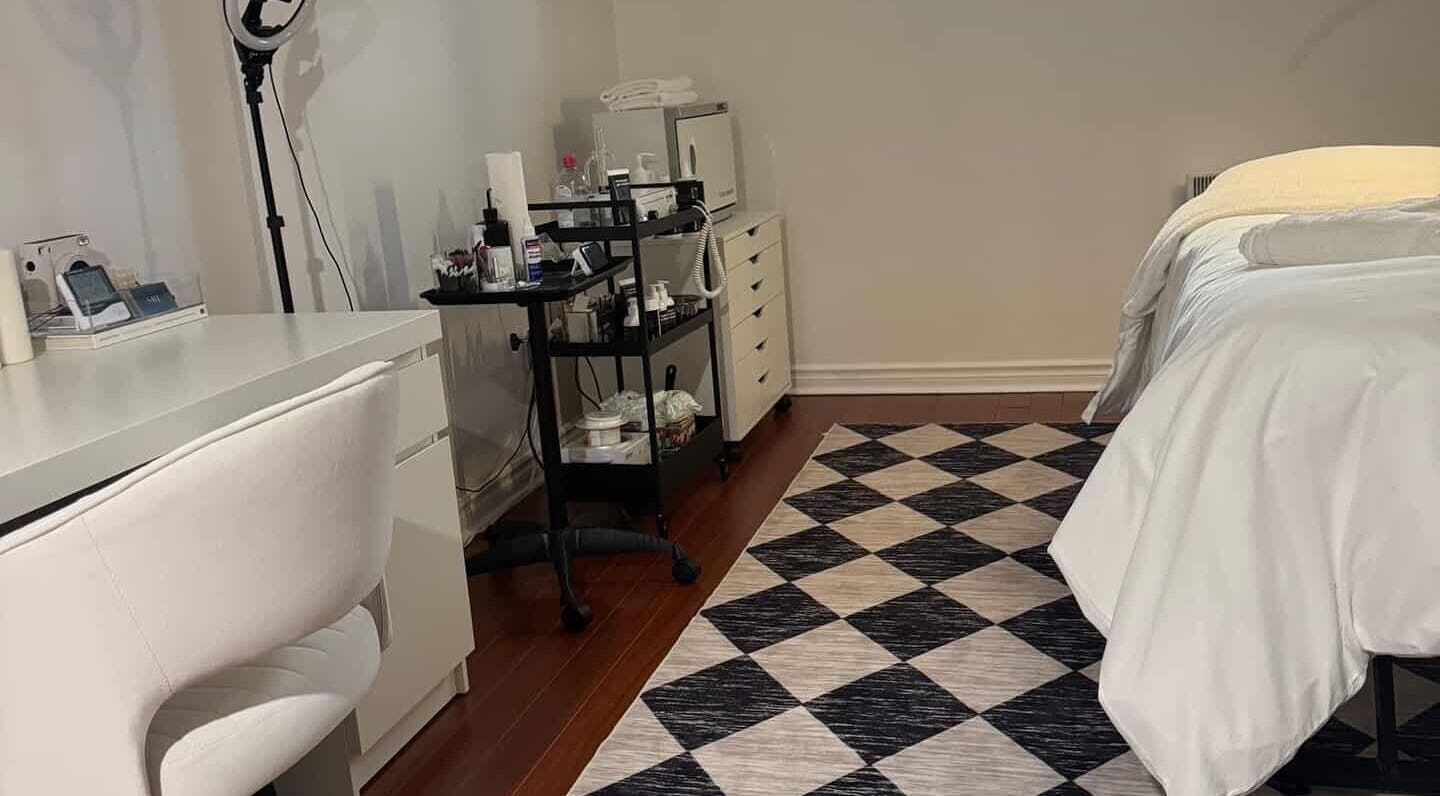 Relaxing spa room at She by Eva, Brossard, Québec, CA, featuring treatment bed and modern decor.