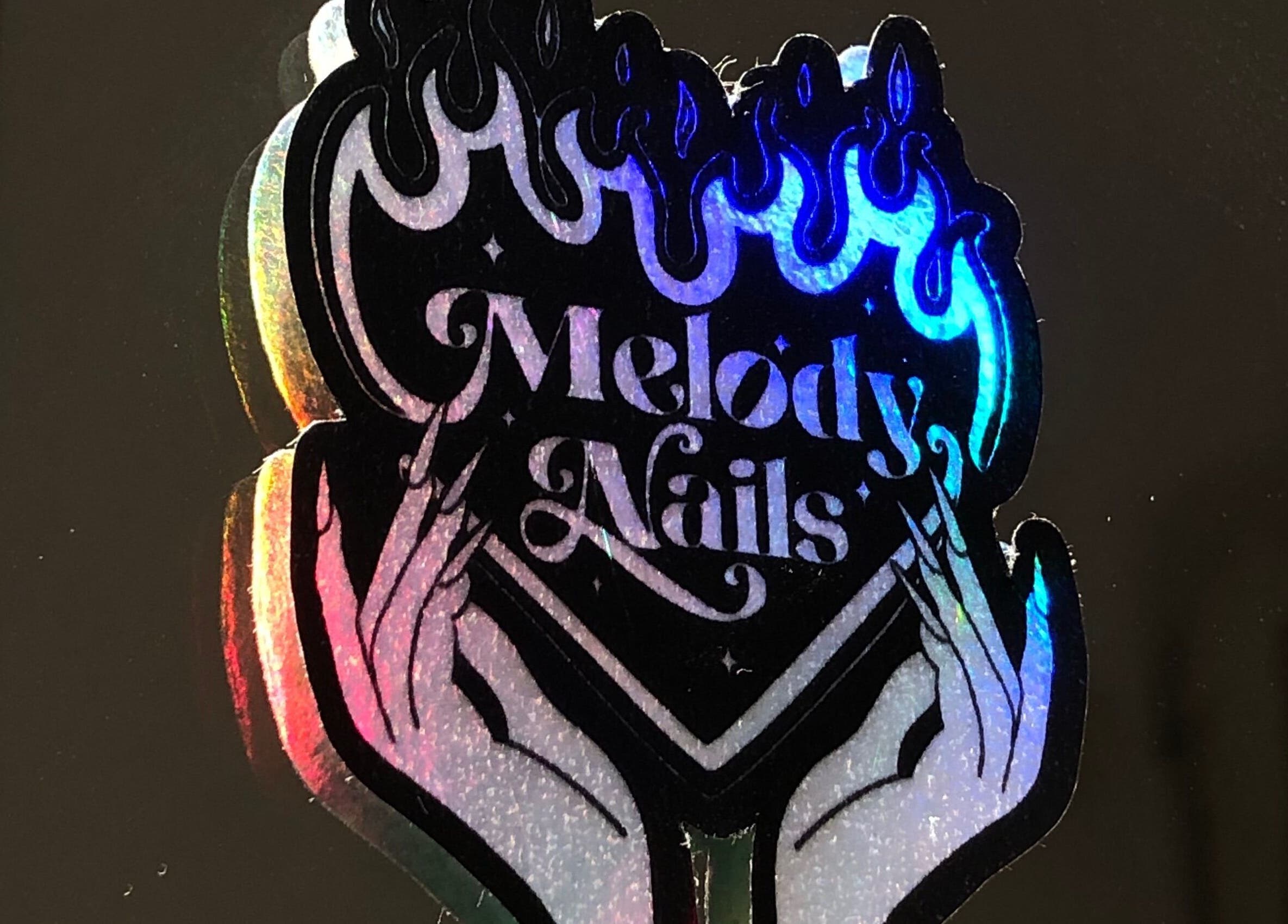 Calcomanía con diseño de fuego de Meloody Nails en Cali, Valle Del Cauca, CO.
