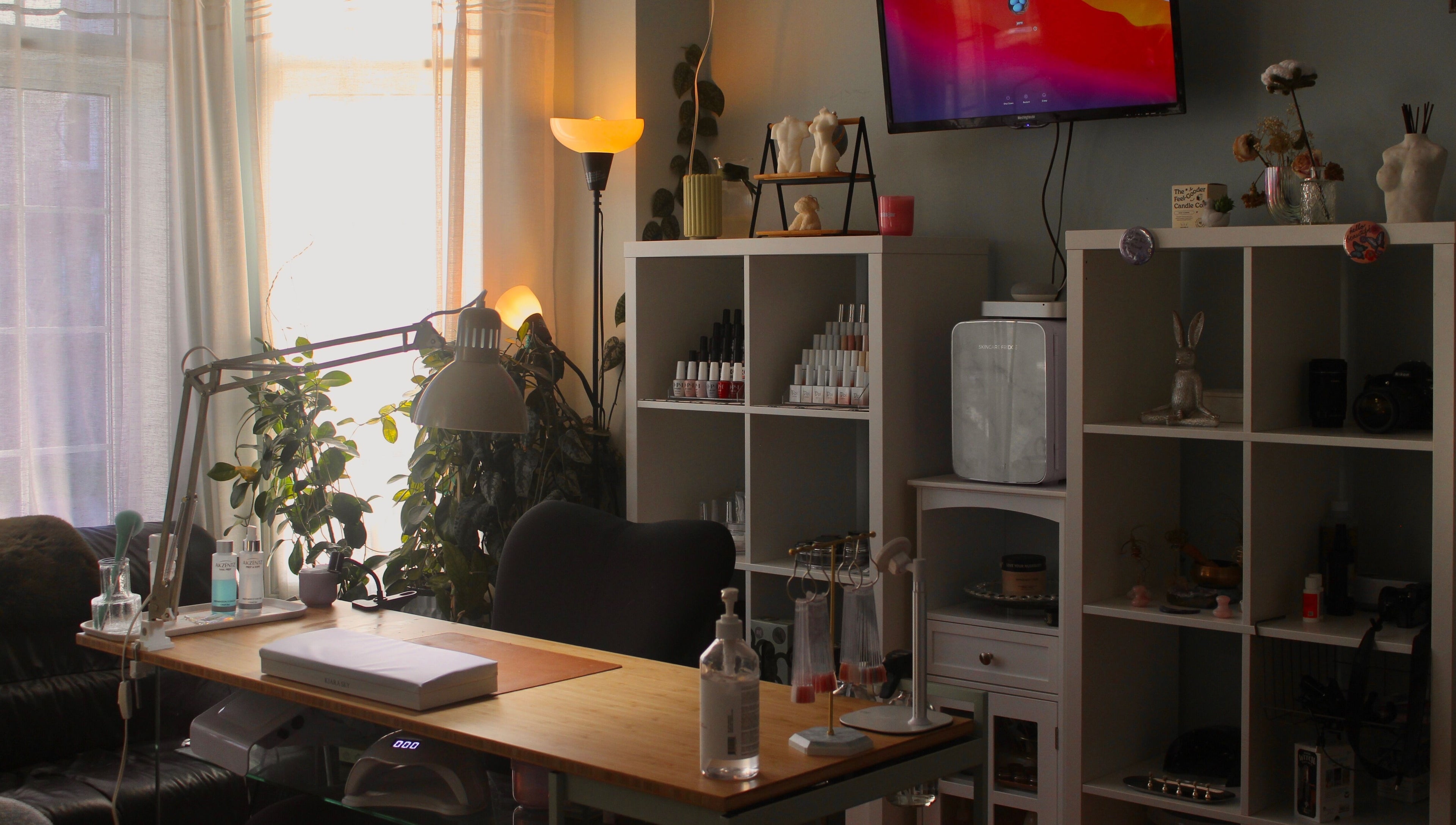 Cozy nail workspace at Reach Medspa & Manicures, Mississauga, Ontario, CA with stylish decor and nail polish display.