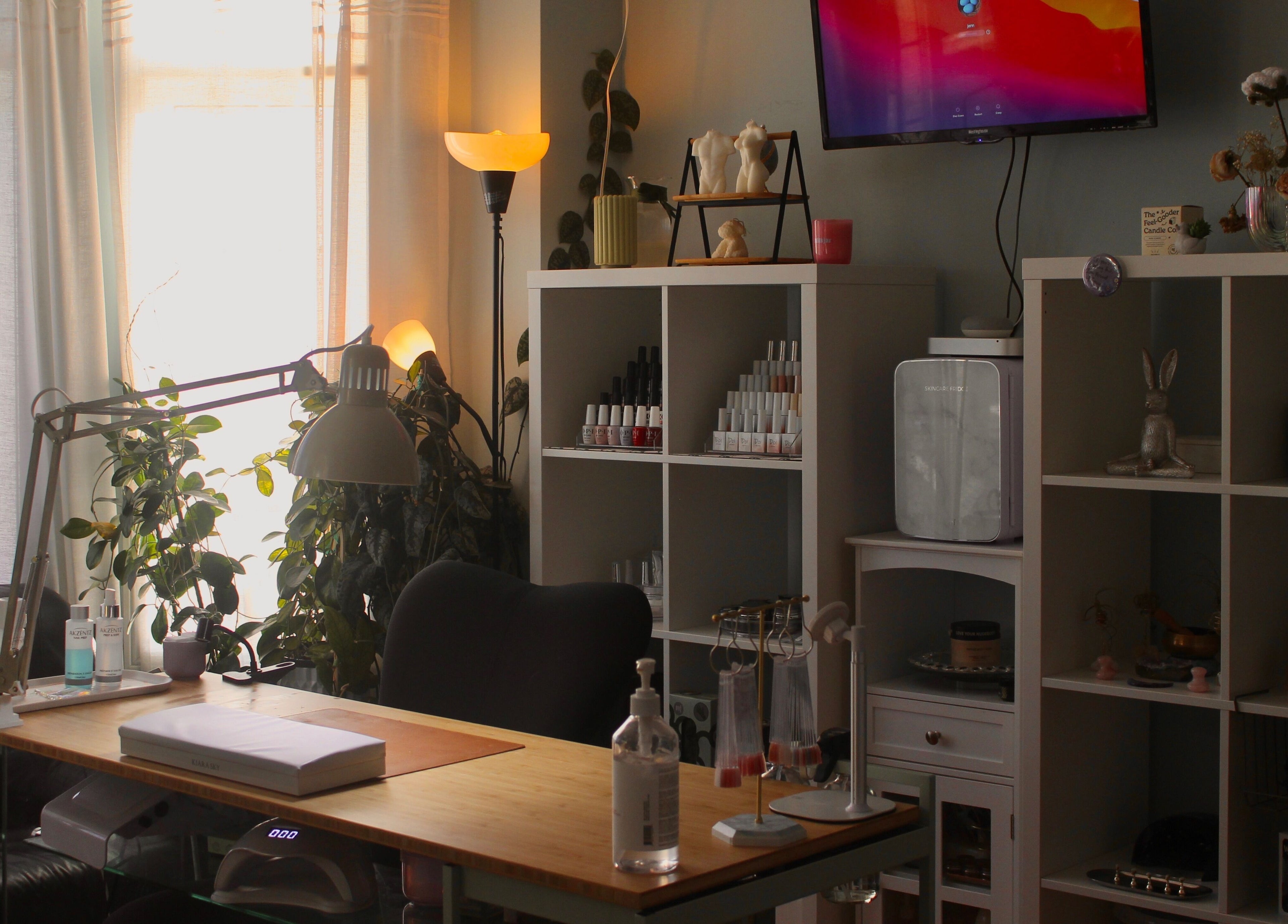 Cozy nail workspace at Reach Medspa & Manicures, Mississauga, Ontario, CA with stylish decor and nail polish display.