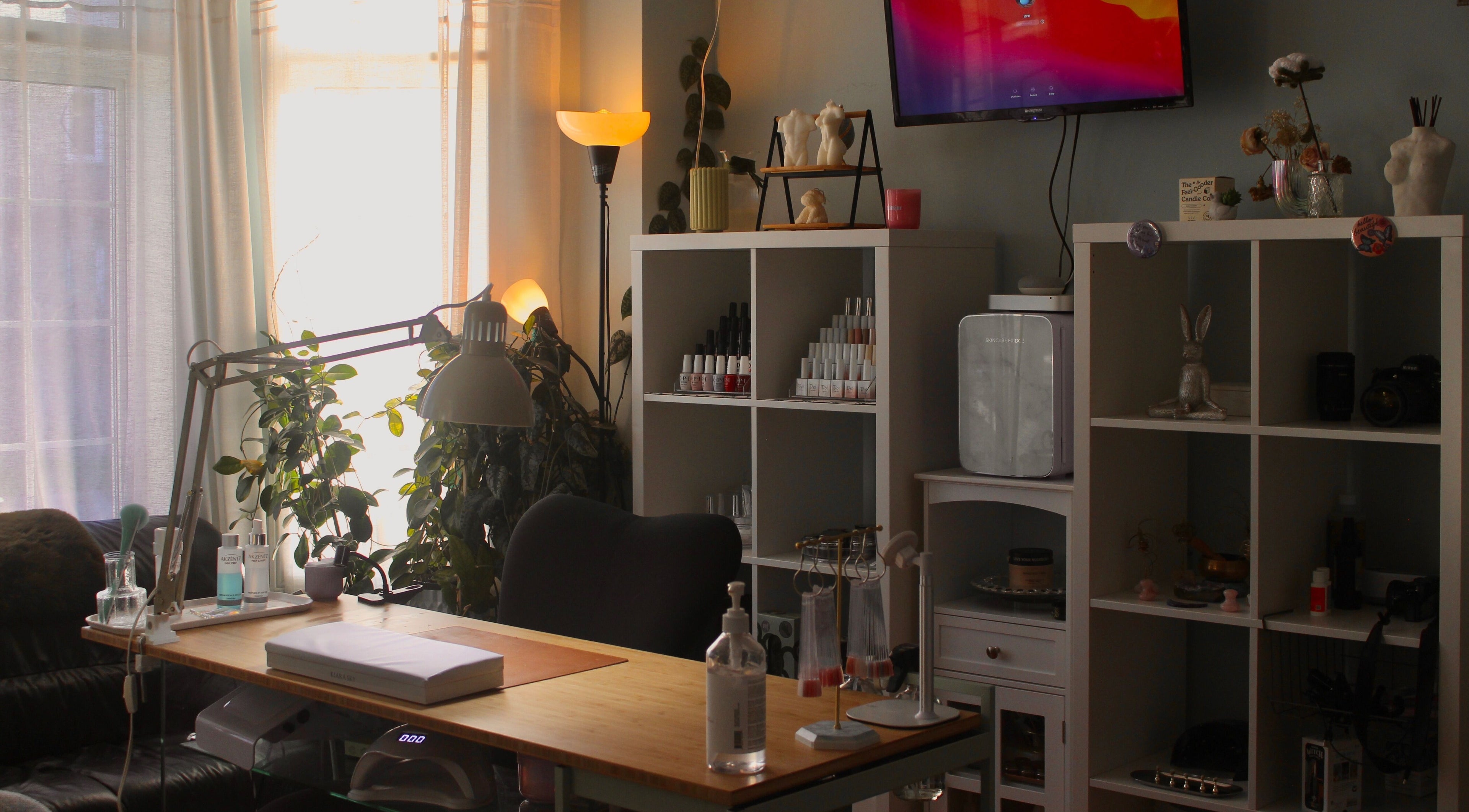 Cozy nail workspace at Reach Medspa & Manicures, Mississauga, Ontario, CA with stylish decor and nail polish display.