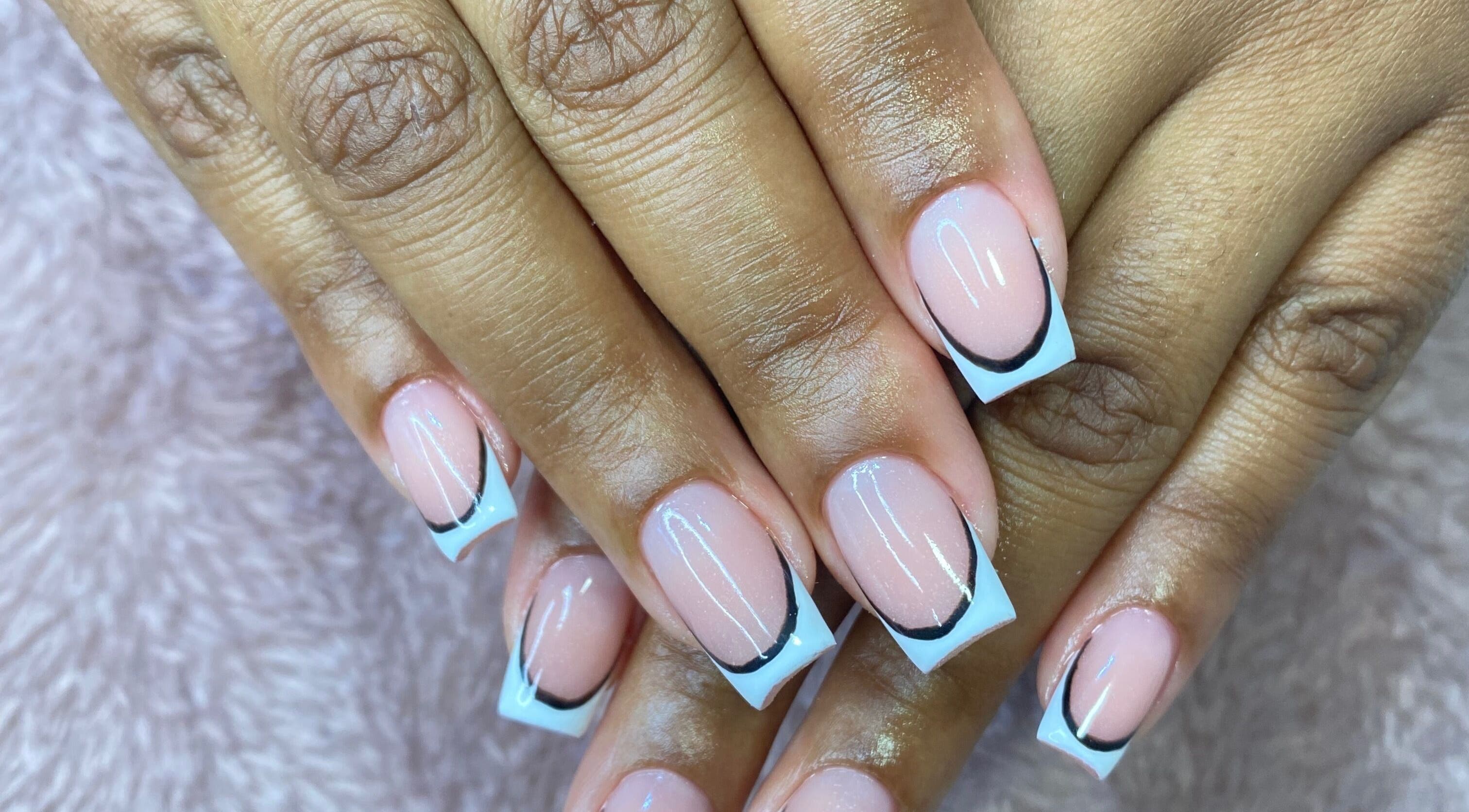 Stylish French manicure at Bkt Nails, Pretoria, Gauteng, ZA showcasing elegant nail art.
