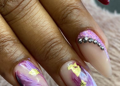 Elegant nail art with purple swirl and rhinestones at Bkt Nails, Pretoria, Gauteng, ZA.
