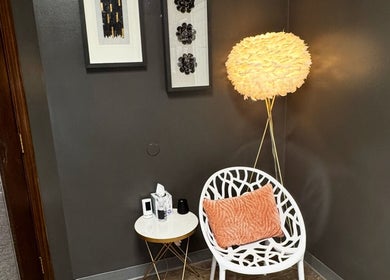 Inviting seating area at Endlessly Connected - Washington, MO, featuring artistic lamp and decor, Washington, Missouri, US.
