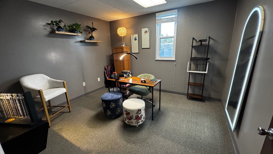 Cozy, serene wellness space at Endlessly Connected- Chesterfield, Chesterfield, Missouri, US, with desk and plants.