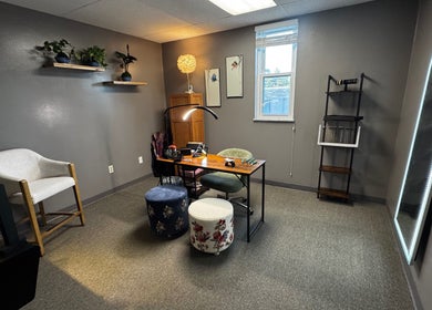 Cozy, serene wellness space at Endlessly Connected- Chesterfield, Chesterfield, Missouri, US, with desk and plants.
