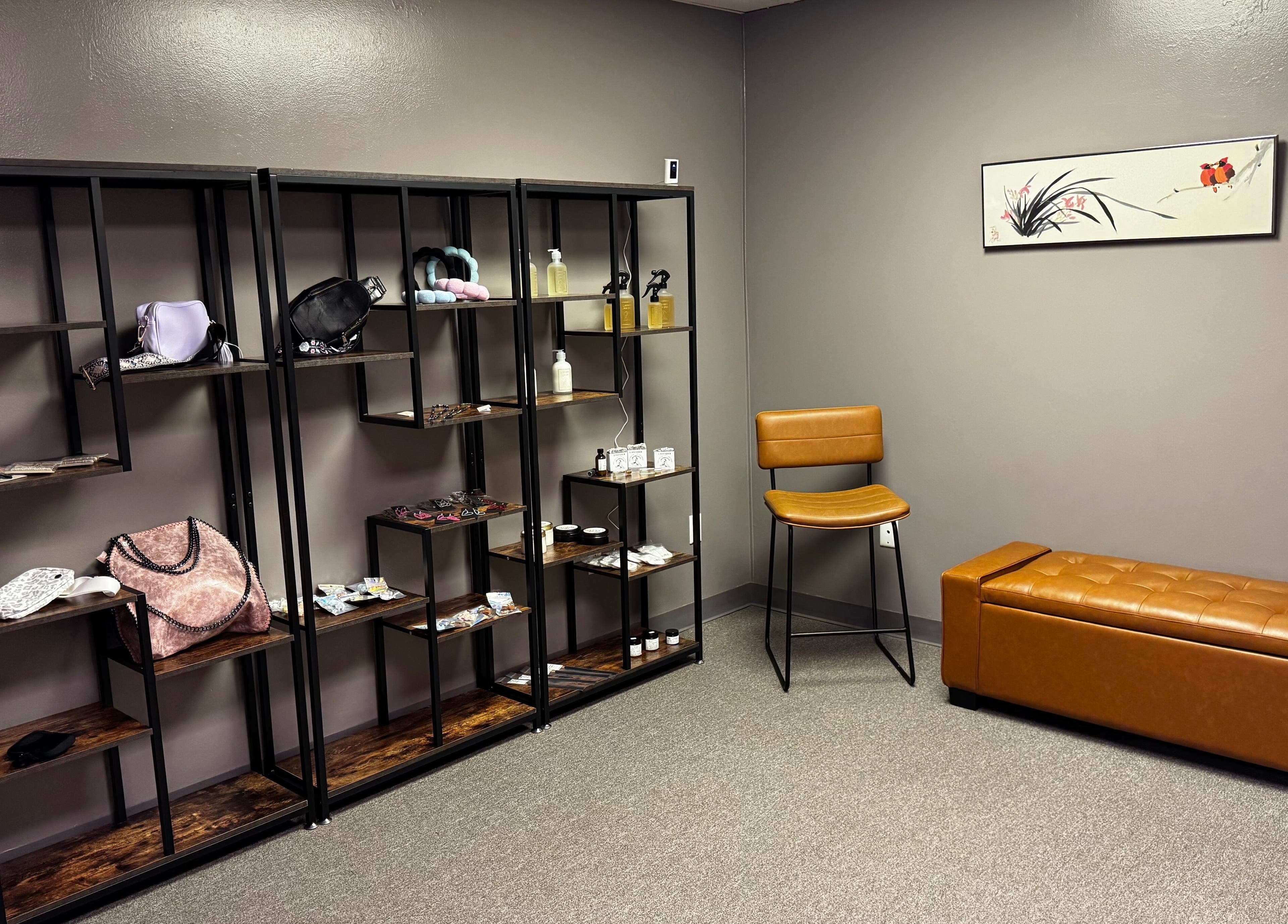 Chic retail corner with shelves and seating at Endlessly Connected- Chesterfield, Chesterfield, Missouri, US.