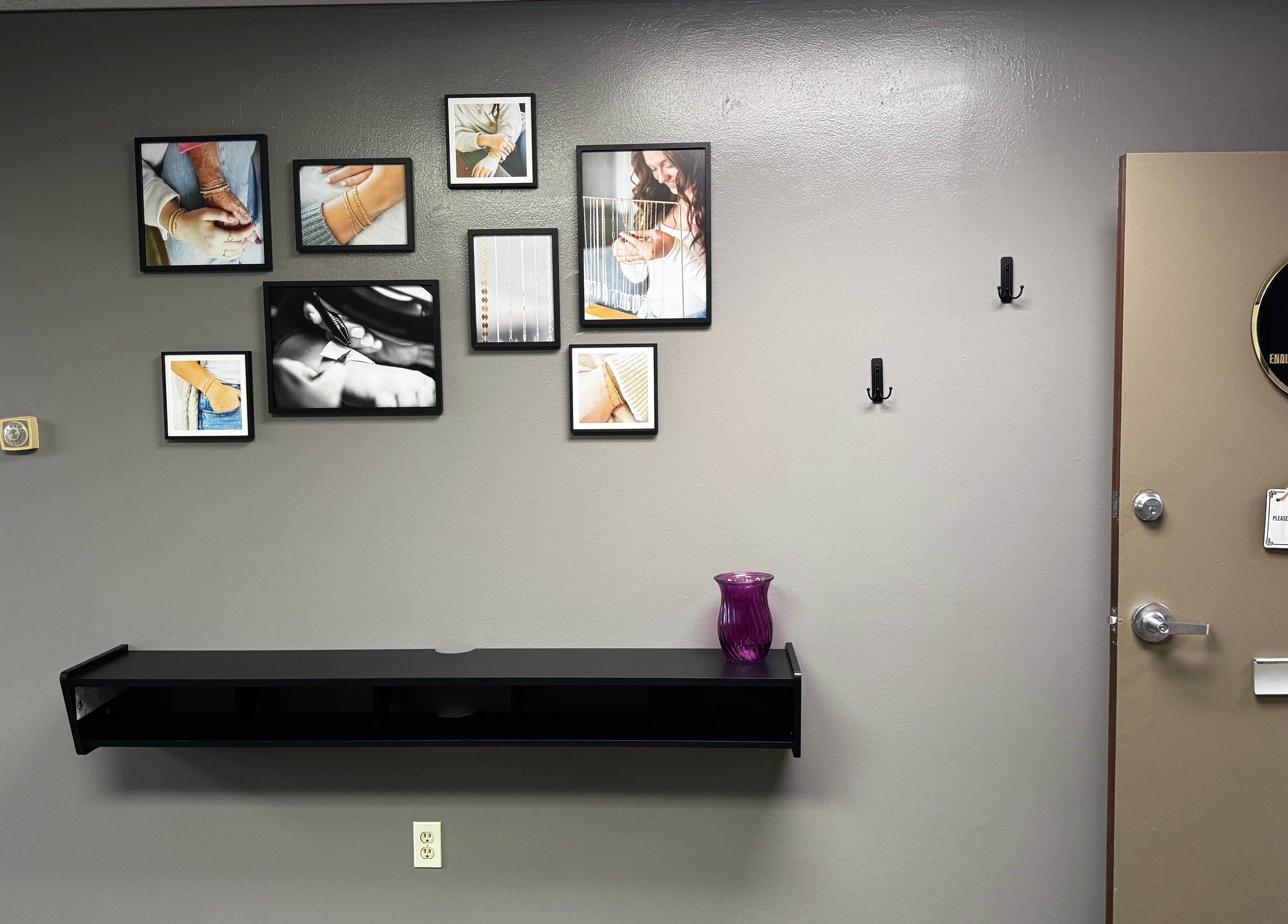 Gallery wall at Endlessly Connected- Chesterfield, showcasing jewelry art in Chesterfield, Missouri, US.
