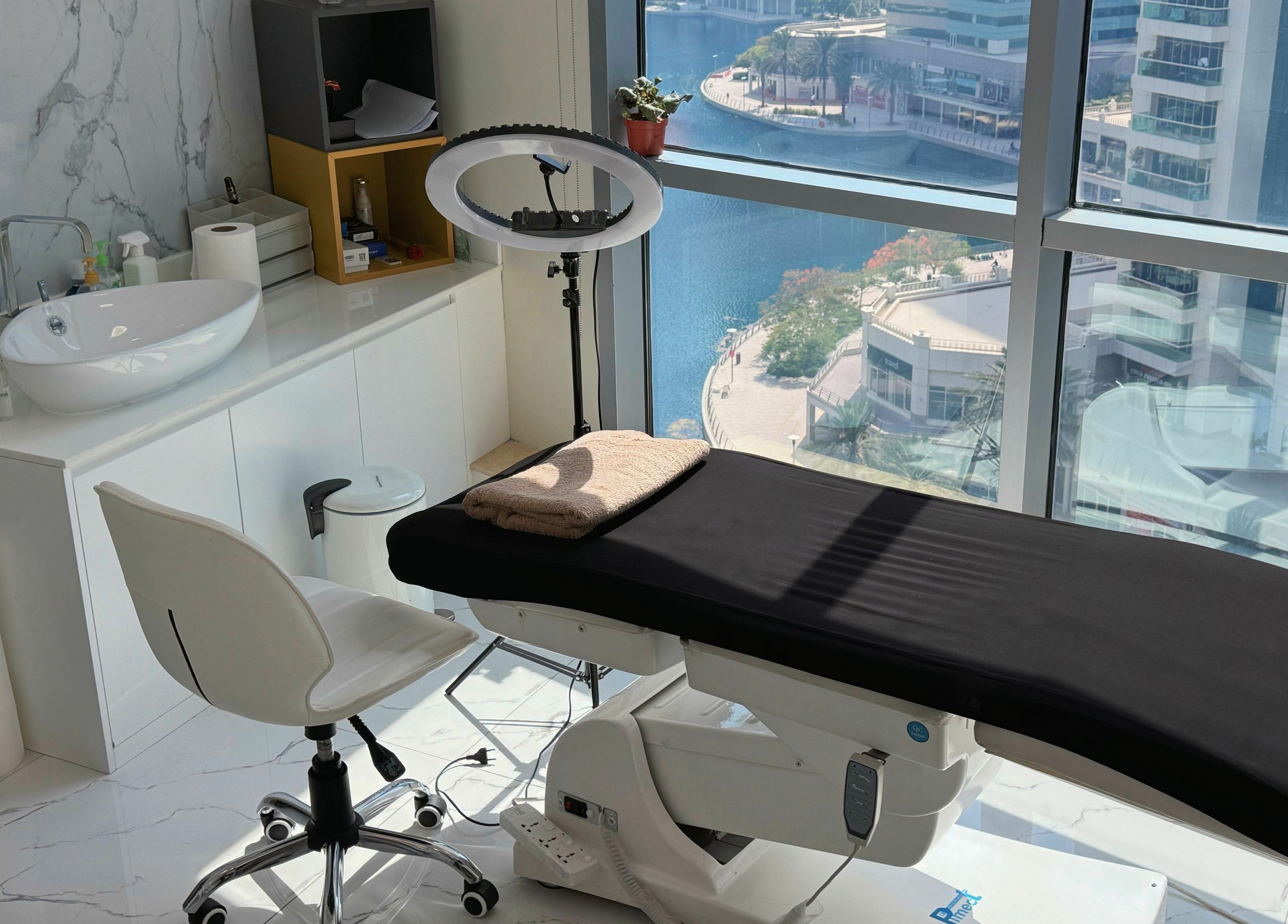 Modern treatment room at Sunface Medical Aesthetic Center, Dubai, Dubai, AE with a scenic city view.